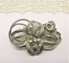 Vintage filigree brooch A FLOWER  silver alloy handcrafted length: 1 3/4 inches, 4.4 cm A cute gift for life Victorian Metal Brooches As Gift, Elegant Silver Metal Brooches, Elegant Silver Pins For Gifts, Elegant Metal Brooches As Gift, Elegant Silver Flower Brooch, Vintage Silver Flower Brooches, Ornate Flower Brooch As A Gift, Silver Vintage Flower Brooches, Silver Flower Brooch Pins