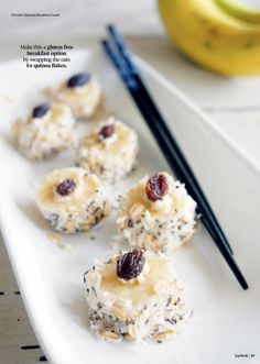 some food is sitting on a white plate next to a banana and chopsticks