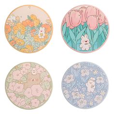 four plates with flowers painted on them