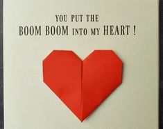 an origami heart shaped card with the words you put the boom boom into my heart