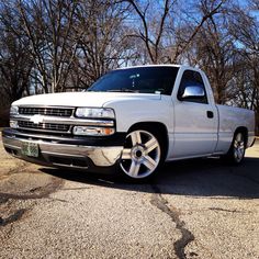 a white pickup truck parked in a parking lot