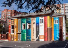 a multicolored building with lots of books painted on it