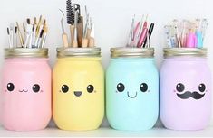 four painted mason jars with pens and pencils in them, all decorated to look like mustaches