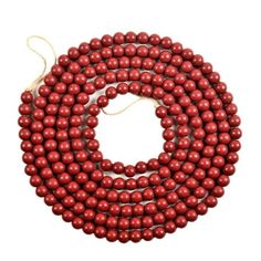 red beads are arranged on a white background