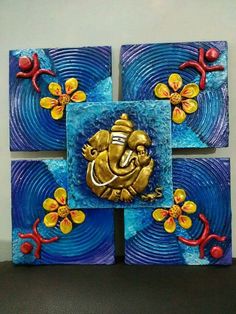 three square paintings with an elephant on one side and flowers on the other hand painted