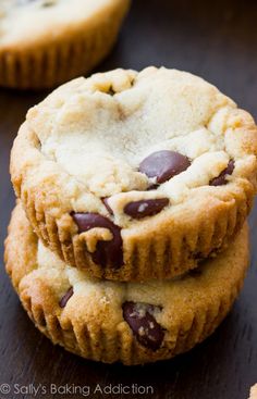 two chocolate chip cookies stacked on top of each other with one cookie in the middle