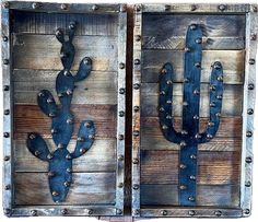 two wooden boxes with metal cactus designs on the sides and one is painted in blue