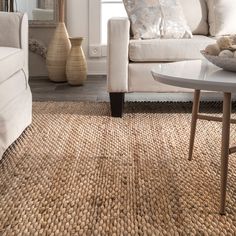 a living room scene with focus on the couch and coffee table in the foreground