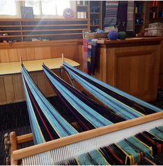 an old weaving loom in the middle of a room