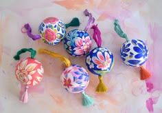 colorful painted balls and tassels on a table