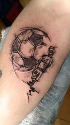 a tattoo with a soccer ball on it