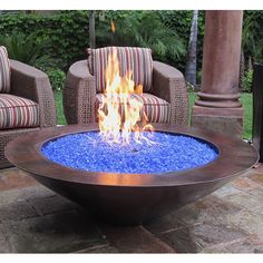 a fire pit sitting on top of a stone patio