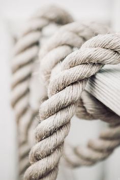 closeup of rope on a ship's mooring post, black and white photograph