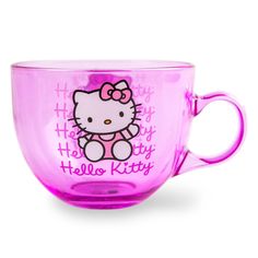 a pink hello kitty coffee cup with the word hello kitty on it's side