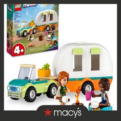 the lego friends camper is in front of a box with its contents on it