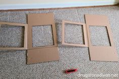 three pieces of cardboard sitting on the floor