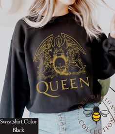 Free shipping on orders over $100. All discounts will be automatically calculated at the checkout. For fans of Queen Band and Freddie Mercury, we have created a fantastic design. This sweatshirt will become one of your favorites, which you will wear to festivals and concerts. Don't you want to give this t-shirt as a gift? Other Queen Band products Gold Design Hoodies : https://www.etsy.com/listing/1347400150 White Design Hoodies: https://www.etsy.com/listing/1361402045 Black Design Hoodies : htt Queen Band Sweater, Queen Sweatshirt, Queen Shirt, Band Sweatshirts, Queen Band Shirt, Queen Gifts, Band Outfits, Queen Tshirt, Queen Outfit