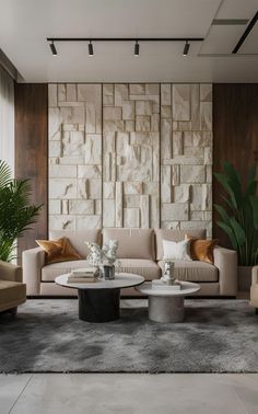 a living room with two couches and a coffee table in front of a stone wall