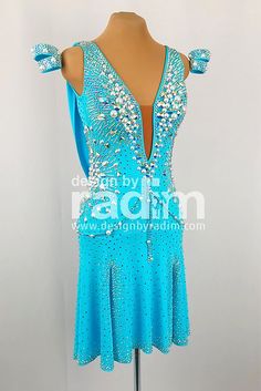 a blue dress with sequins on it