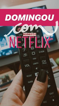 a hand holding a remote control in front of a tv with the words dominou com on it