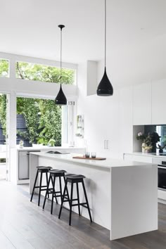 the kitchen is clean and ready to be used as a dining room or living room