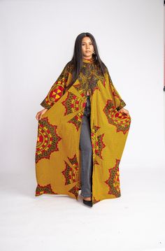 This exquisite outfit is an ideal choice for any occasion, be it a date, hangouts, work, church, dinner, movie night, birthday, wedding or any party. Its versatility ensures it's the perfect fit for every occasion. Features: - Crafted by hand from 100% African wax cotton As always, our designs are completely handmade and can be customized to your liking, this means you're welcome to request alterations, whether it's custom lengths for petite or tall individuals, design element additions or removals, or a different fabric selection. Just get in touch with us and we will be happy to take any special request. For the best fit, you can provide your measurements or select your size from our accurate size chart. Don't forget to include your height when ordering to ensure the perfect length. Care Vibrant Print Long Maxi Dress, Yellow Batik Print Dresses, Patterned Printed Tunic Maxi Dress, Fitted Multicolor Floor-length Kaftan, Yellow Printed Long Sleeve Dress, Long Batik Print Dress, One Size, Fitted Multicolor Kaftan With Kimono Sleeves, Free Size Long Batik Print Dress, Long Free Size Batik Print Dress