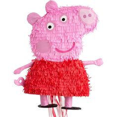 a pink peppa pig in a red dress on a bike with her arms out