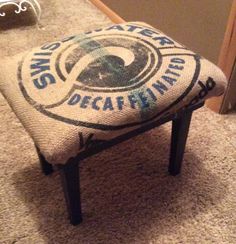 a small foot stool sitting on top of a carpeted floor