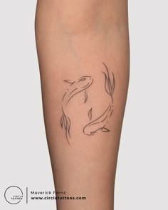 a woman's leg with a fish tattoo on the side of her calf, which is drawn in black ink