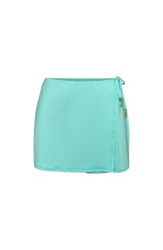 Reflecting the translucent quality of beach glass, this greenish-blue hue captures coastal calm, pairing well with various shades for a beach-inspired look. A mini silhouette instantly flatters the figure, creating a flirty and alluring look. Equally suited for swimsuits or a cute cami, it's the perfect throw-on-and-go piece to keep your look sophisticated. [split] Details Wrap skirt Adjustable side-ties Gold charms Above the knee Fabric 83% Nylon, 17% Lycra Elastane Coastal Calm, Skirt Coverup, Gold Charms, Beach Skirt, Greenish Blue, Beach Inspired, Beach Glass, Gold Charm, Blue Hues