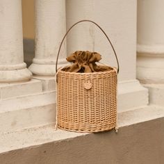 Handmade wicker basket with leather handle. Size: Diameter: 20 cm Height: 20 cm Spring Top Handle Straw Bag, Chic Straw Bag For Spring Picnic, Summer Straw Bag With Top Handle, Chic Spring Straw Bag For Picnic, Rectangular Straw Bag With Leather Handles For Day Out, Spring Top Handle Straw Bucket Bag, Summer Top Handle Straw Beach Bag, Chic Bucket Bag For Picnic, Handmade Brown Rattan Beach Bag