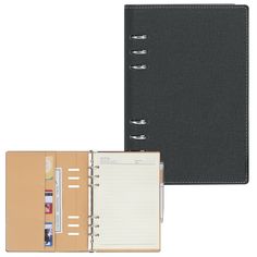 a black binder with a note book and pen