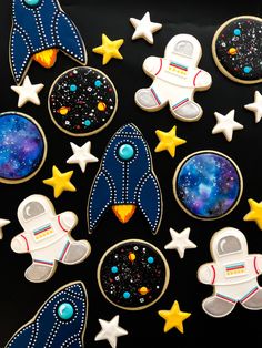 some cookies are decorated with space and stars