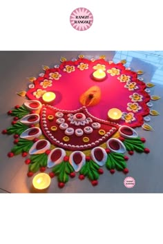 a decorated rangdi with candles on the floor