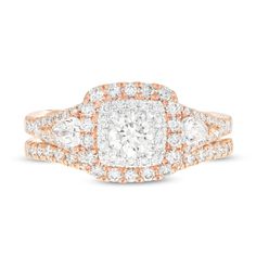 two tone gold and white diamond engagement ring with an oval shaped center surrounded by smaller round diamonds