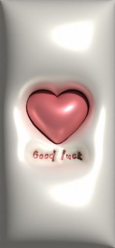 a red heart with the words good luck on it in front of a white background