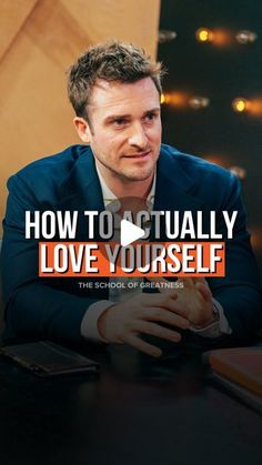 a man sitting at a table with the words how to actually love yourself