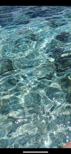 the water is crystal clear and there are rocks in it