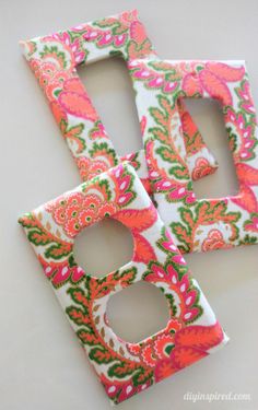 three pieces of fabric that have been made to look like the letters d and f