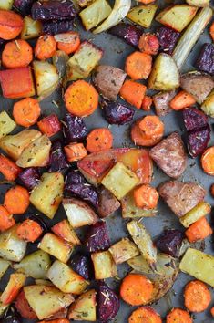 roasted carrots and beets on a baking sheet