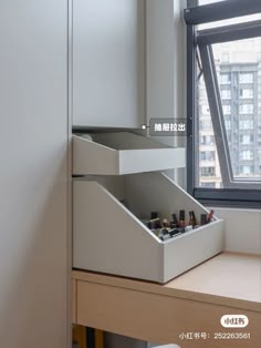 an open drawer in front of a window