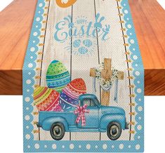 a blue truck with an easter decoration on the side and a cross in the back