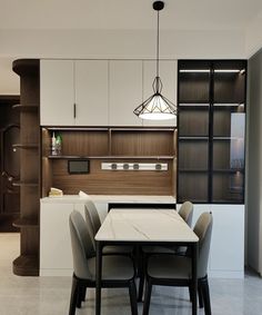 a dining room table with four chairs around it