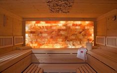 the inside of a sauna with wooden benches