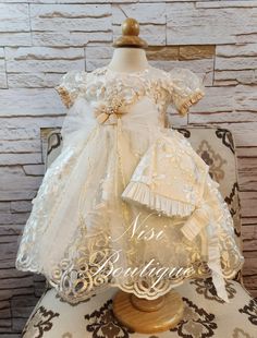 "★Beautiful Ivory Christening Gown, Baptism Dress★ ★Occasion: Baptism, Child Blessing or any Special Occasion ★Comes With: Dress, Bonnet and dress Bag ★Measurements 6-9 Months, (Long 20\") (Waist 18\")  (Shoulder to Shoulder 8\") 9-12 Months, (Long 23\") (Waist 20\")  (Shoulder to Shoulder 8.5\") 12-18 Months, (Long 24\") (Waist 21\")  (Shoulder to Shoulder 9\") -Waist measurement is around ★Features: The back of the dress has ties for greater comfort when the girls put it on. (The waist is adjustable, has two ribbons to make a bow, as in the photo) The measurements are approximate, they can change a little bit. Please check the measurements in the last picture, and any questions or more photos of any particular size send me a message, your satisfaction is very important for me. Comes with Fitted Cream Dress For Pageant, Cream Baptism Dress For Ceremony, Fitted Cream Gown For Pageant, Fitted Cream Gown For Pageants, Elegant Cream Gown For Pageant, Cream Baptism Dress With Ruffles For Pageant, Pageant Baptism Dress In Cream With Ruffles, Cream Ruffled First Communion Dress For Baptism, Cream Ruffled Gown For Baptism