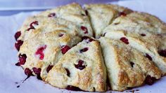 a cake with cranberry toppings on top of white paper