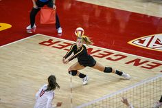 a female volleyball player in action on the court