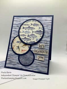 a close up of a greeting card with two fish on it and the words let's celebrate you