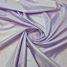 the fabric is very soft and shiny with some light purple colors on it's surface