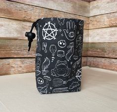 a black bag with white drawings on it